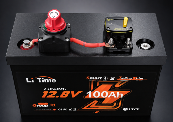 A black Li Time LiFePO4 12.8V 100Ah battery with a red terminal cap and a  relay on top, set against a dark studio background.